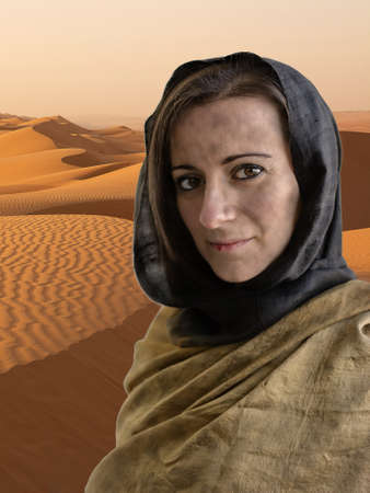 Portrait of woman with hijab and in the background the desert