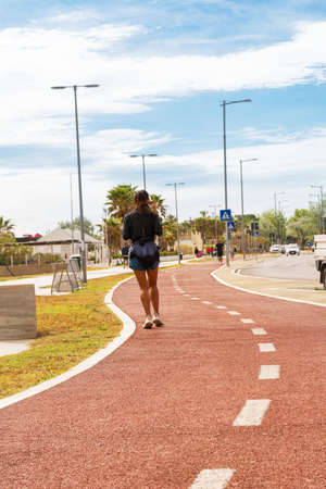 Pescara, Italy - 22 May 2021: Runner on the pedestrian street while running in the morning in...