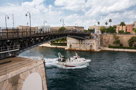 Taranto, Italy - 18 august 2021: The swing bridge of Taranto that separates the new city from the...