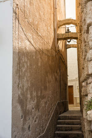 One of the narrow alleys in the center of Monopoli (Puglia, Italy)の写真素材