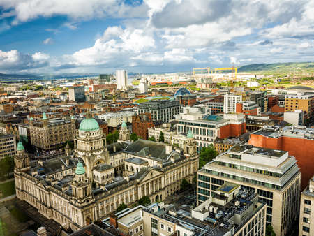 Belfast, United Kingdom - 20 May 2022: Aerial view of the city with CIty Hall in the foreground from a skyscraper, Belfastのeditorial素材