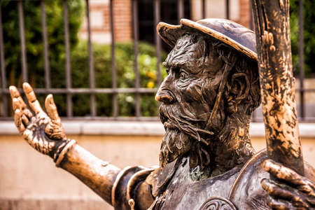 Close-up of the face of the statue of Don Quixote by Cervantes in front of the house of Alcala de...