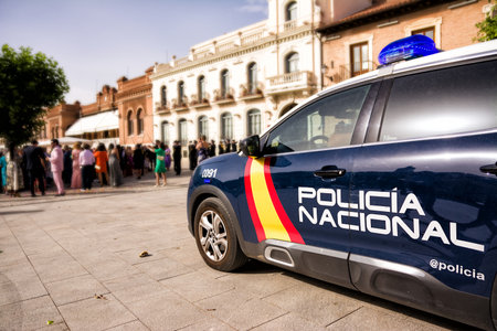 Police car with crowd in the backgroundのeditorial素材