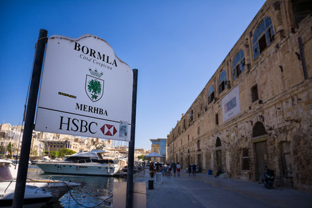 Cospicua, Malta - 17 June 2023: Cospicua port pier with road signのeditorial素材