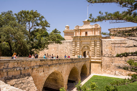 Mdina, Malta - 20 June, 2023: Bridge and entrance to the fortified city of Mdina on the island of Maltaのeditorial素材