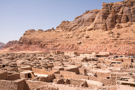 Ruins of the old city of Al Ula in Saudi Arabia featuring ancient stone buildings in a desert landscape and a historic Middle Eastern heritage siteの写真素材