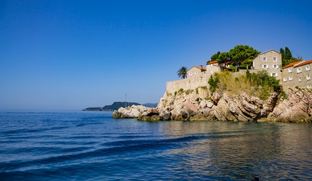 Beautiful european old hotel resort on rocks with stone buildingsのeditorial素材