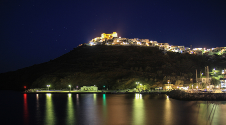 Night shot of the Astypalaia castle and Chora, in Greece. Shot from the old port during August time.のeditorial素材