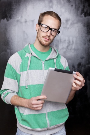 Good Looking Young Nerd Smart Guy Man Using Tablet Computerの写真素材