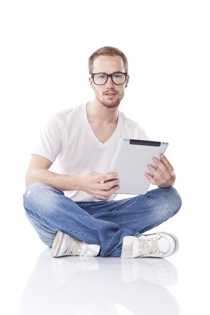 Good Looking Young Nerd Smart Guy Man Using Tablet Computerの写真素材