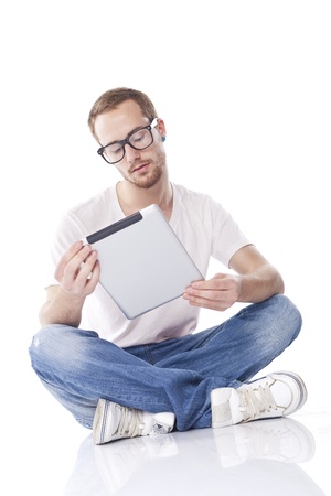 Good Looking Young Nerd Smart Guy Man Using Tablet Computerの写真素材