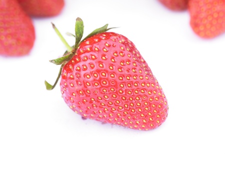 One Red Strawberry Fruit On White Backgroundの写真素材