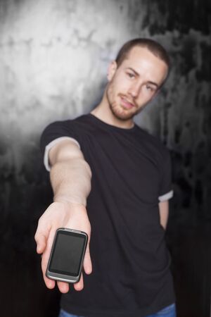 Young Men holding smartphoneの写真素材