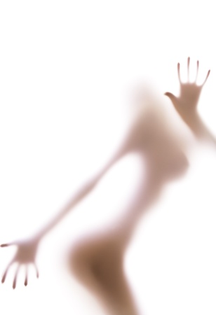 Blurred glass of bathroom hiding sexy female silhouette, handsの写真素材