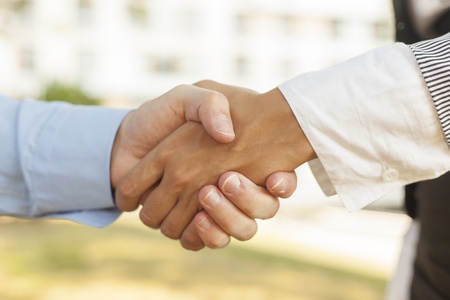 Businesspeople handshake - Woman and men shakinghandの写真素材