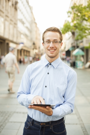 Businessman Man Using Tablet Computer in public spaceの写真素材