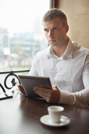 Businessman on Coffee break in restaurant - face in focusの写真素材