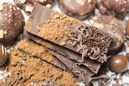 Parts of dark chocolate on the tableの写真素材