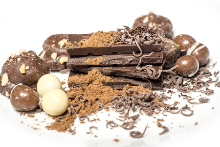 Parts of dark chocolate on the tableの写真素材