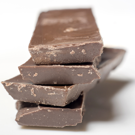 Parts of dark chocolate on the tableの写真素材