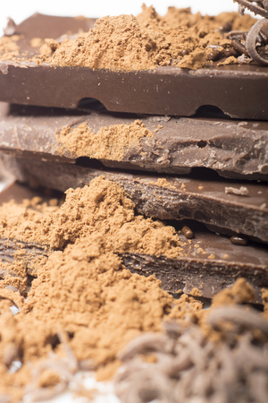 Parts of dark chocolate on the tableの写真素材