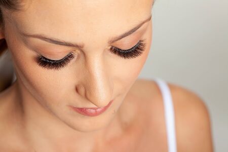 Treatment of Eyelash Extension. Lashes. Woman Eyes with Long Eyelashes.の写真素材