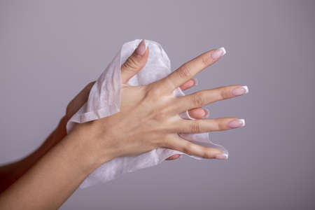 Cleaning hands with wet wipes, prevention of infectious diseases, corona19の写真素材