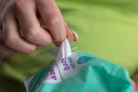 Cleaning hands with wet wipes, prevention of infectious diseases, corona virus covid-19の写真素材