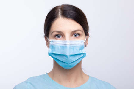 Worried nurse, doctor or scientist portrait behind face mask and protective facemask stock photoの写真素材