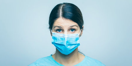 Worried nurse, doctor or scientist portrait behind face mask and protective facemask stock photoの写真素材