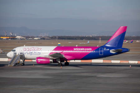 BUDAPEST, HUNGARY - FEBRUARY 04, 2022: Wizz Air Airbus A320 HA-LWK landing at Budapest international airport.のeditorial素材