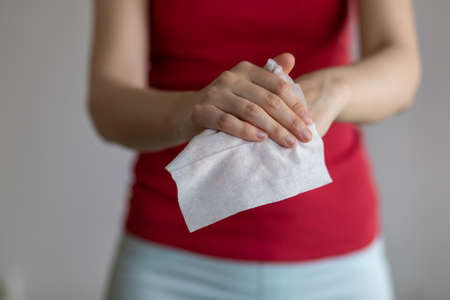 Cleaning hands with baby wet wipes, prevention of infectious diseases, stock photoの写真素材