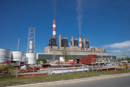 A thermoelectric plant "Nikola Tesla" aka TENT near Obrenovac and Belgrade on river Sava in Serbia, with big chimneys in a rural landscapeのeditorial素材