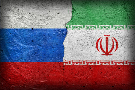 Russia and Iran flags  - Cracked concrete wall painted with a Russian federation flag on the left and a North Korean flag on the rightの写真素材