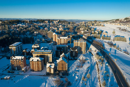 Panoramic aerial view of new buildings for sale on Zlatibor town and clear sky over Zlatibor Mountain at winter sunset, Cajetina, Serbia.の写真素材