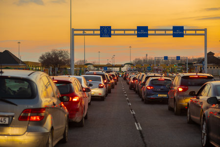 Horgos Roszke, Hungary - February 17, 2025: Long Queue of Pasengers Cars Stuck at EU Border Entrance...
