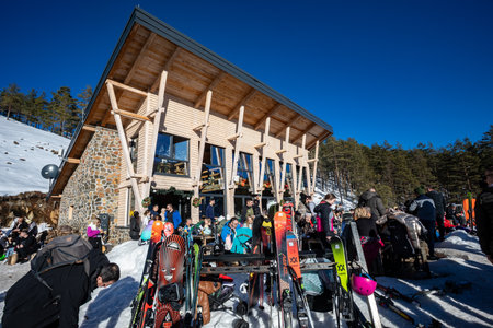 Skiers and hikers enjoy a sunny day at the Crni Vrh ski resort in DivÄibare,