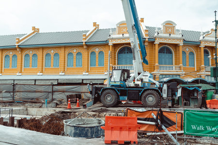 Construction site with beautiful facades of building. Road construction machinery scene.