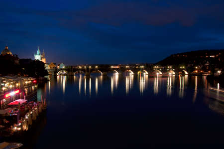 Night look on nabarezhny the Vltava Rivers and Karlov Bridge in Prague  の写真素材