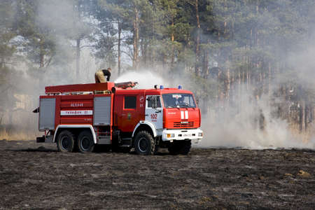 the fire crew extinguishes a burning grass in the settlement  Thresholds on May 04, 2013のeditorial素材