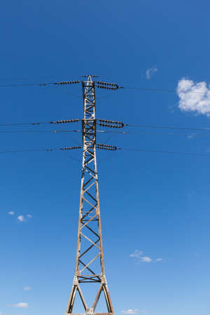 High voltage electric main against the dark blue skyの写真素材