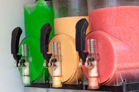The beautiful machine gun doing the different frozen drinksの写真素材