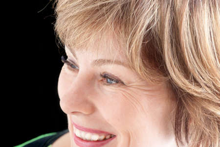 portrait of the beautiful young woman on a black background