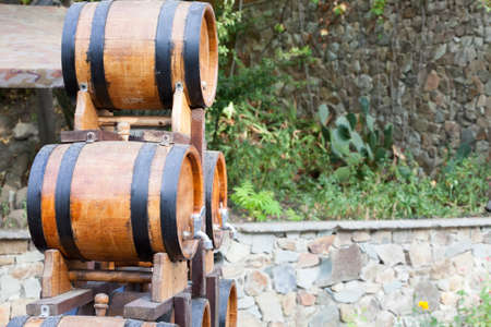 the barrels with wine standing on streets of the Crimea in summer day