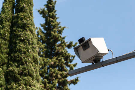 the camera of fixing of speed of the car which is freezing up over the road in summer dayの写真素材