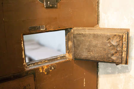 window at doors of the prison cell, prisonの写真素材