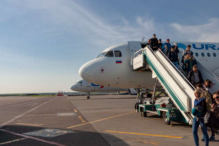 DOMODEDOVO,RUSSIA-MAY 04 2018 : passengers go out of the arrived plane. The Domodedovo-largest international airport of Russiaのeditorial素材