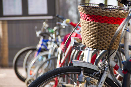 the bicycle with a shopping cart on the city cycle parking in clear summer day