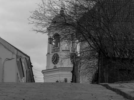 the ancient bell tower in Vyborg in summer day, a cobblestone road,black-and-whiteの写真素材