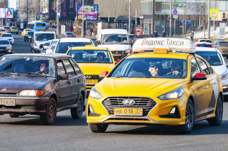 Moscow,Russia-February 15,2020.Yandex taxi car in traffic jam on a Moscow street.very heavy traffic...